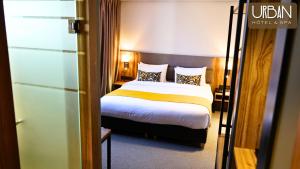 Postel nebo postele na pokoji v ubytování Urban Hotel & Spa