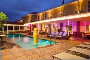 a swimming pool with a yellow object in the middle at Protea Hotel by Marriott Nelspruit in Nelspruit