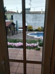 a door view of a patio with a view of a pool at Querido, Vamos de Férias! in Vagos