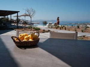 a basket of fruit sitting on top of a table at Olithos Villas in Krotiri