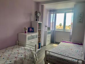 Łóżko lub łóżka w pokoju w obiekcie SEAVIEW La Mata pool&beach