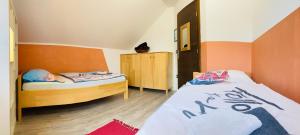 Postel nebo postele na pokoji v ubytování Family House