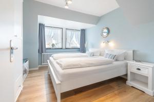 Un pat sau paturi într-o cameră la Ferienanlage am Trift