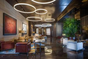 a lobby of a hotel with couches and tables at JW Marriott Hotel Santo Domingo in Santo Domingo