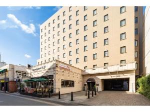a large building on a street in front of a building at Plaza Hotel Premier - Vacation STAY 40093v in Fukuoka
