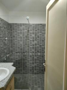 a bathroom with a shower and a sink at Marena Hurghada in Hurghada