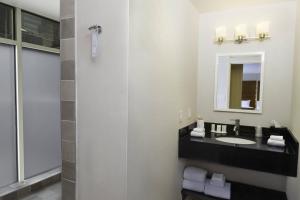 a bathroom with a sink and a mirror at Fairfield Inn & Suites by Marriott New York Manhattan/Fifth Avenue in New York