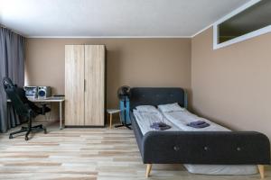 Ένα ή περισσότερα κρεβάτια σε δωμάτιο στο Studio parking TV WiFi