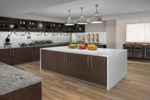 a large kitchen with a white counter top and wooden cabinets at Residence Inn by Marriott Washington - DC/Foggy Bottom in Washington, D.C.