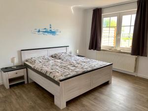 En eller flere senger på et rom på Sundblick, ideal für Familien
