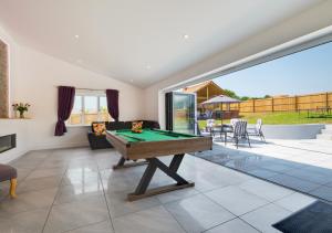 an image of a living room with a pool table at Bowjy in Menheniot