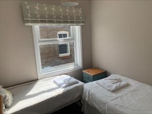 Ein Bett oder Betten in einem Zimmer der Unterkunft Arrandale Apartments