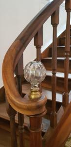 a glass goblet on a wooden spiral staircase at Domaine et Manoir du Picaud in Monestier