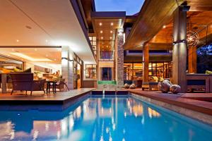 a swimming pool in a house with a house at étoile brillante du matin in Sandton