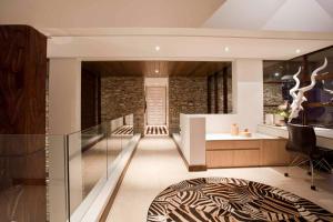 a hallway of a house with a glass wall at étoile brillante du matin in Sandton