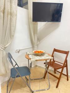 TV a/nebo společenská místnost v ubytování Home Giuseppe