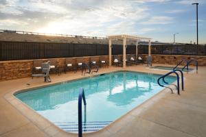 a swimming pool on top of a building at Fairfield by Marriott Inn & Suites Palmdale West in Palmdale