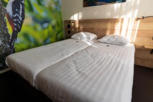 Postel nebo postele na pokoji v ubytování Hotel de Stoppelberg