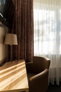 TV a/nebo společenská místnost v ubytování Hotel de Stoppelberg