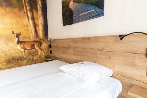 Postel nebo postele na pokoji v ubytování Hotel de Stoppelberg