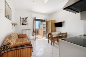 a living room with a couch and a table at Numero 14 in Borgio Verezzi