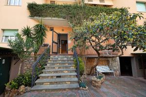 a staircase leading up to a house with plants at Numero 14 in Borgio Verezzi