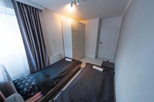 Łóżko lub łóżka w pokoju w obiekcie Exclusive Marina Apartment