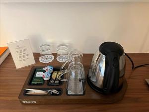 a coffee maker on a tray on a table at Le Clos Medicis in Paris