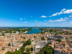 an aerial view of a city with a river at Noemys ARLES in Arles +30 photos