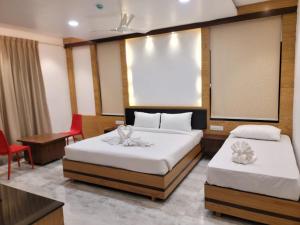 Ένα ή περισσότερα κρεβάτια σε δωμάτιο στο HOTELJURA