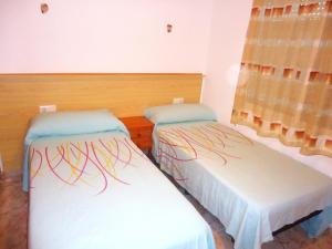 ペニスコラにあるEl Penonの部屋にベッドが2つある部屋