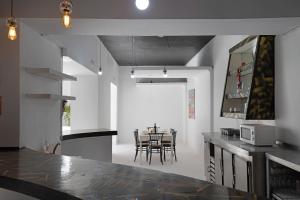 a kitchen with a table and a dining room at Brothers House in Arrecife