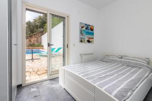 Posteľ alebo postele v izbe v ubytovaní Villa Cuarenta y Dos