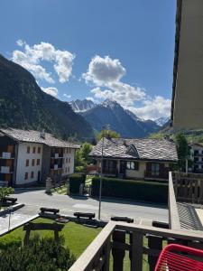 a view from the balcony of a resort with mountains at Casa Sole in Morgex