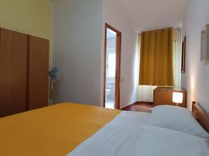 Postel nebo postele na pokoji v ubytování Piccolo Hotel Nuova gestione