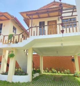 a large house with a large white patio at Villas Montelindo in Constanza