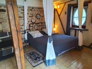 מיטה או מיטות בחדר ב-Chambres d'hôtes Châtres-Sur-Cher