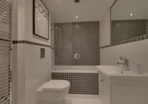 Koupelna v ubytování Pobbles Place + 30 fotografií