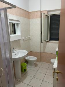 a bathroom with a sink and a toilet at Villa Angela case vacanza in Vieste