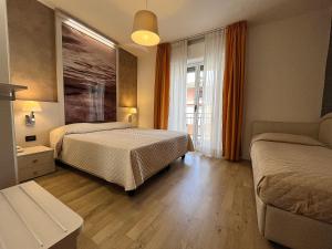 Łóżko lub łóżka w pokoju w obiekcie Hotel Regina