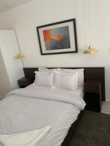 Een bed of bedden in een kamer bij Prinarks luxury Apartment