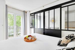 Ένα ή περισσότερα κρεβάτια σε δωμάτιο στο CMG Résidence Sacrée Coeur - Montmartre +45 φωτογραφίες