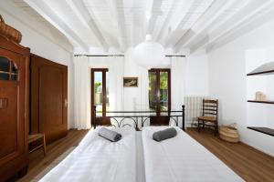 a bedroom with a large bed with two pillows on it at The Lake Garden 1 in Caslano