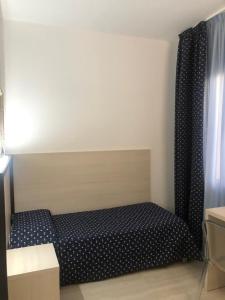 Postel nebo postele na pokoji v ubytování Alloggi Pontecorvo Liviana
