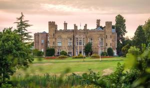 an old castle on a grassy field at Cave Castle Hotel in South Cave