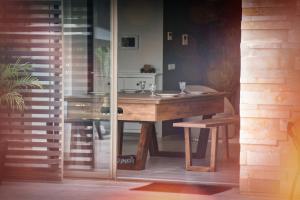 a bathroom with a wooden sink and a mirror at Theme - Taghazout - Luxury villa - 10 Px in Taghazout