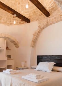Katil atau katil-katil dalam bilik di Trullo PietraBella