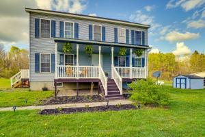 Freeville Home with Covered Porch Near Cayuga Lake! في Freeville: منزل كبير مع شرفة وساحة