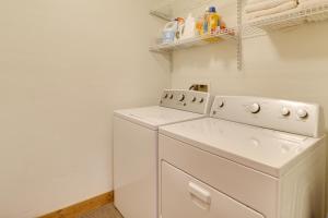 a white washer and dryer in a laundry room at Ski-InandSki-Out Whitefish Duplex with Hot Tub! in Whitefish