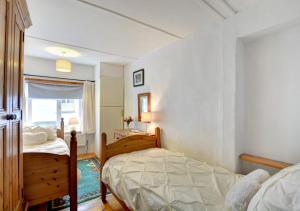 Postel nebo postele na pokoji v ubytování Merryn Cottage